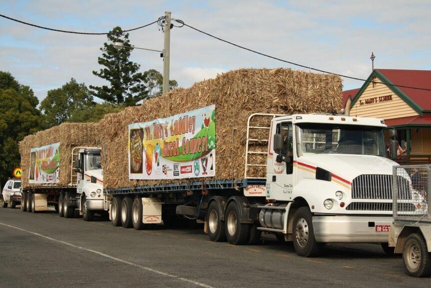 Trucks carrying feed for drought-stricken farmers in the South Burnett head off on their journey.