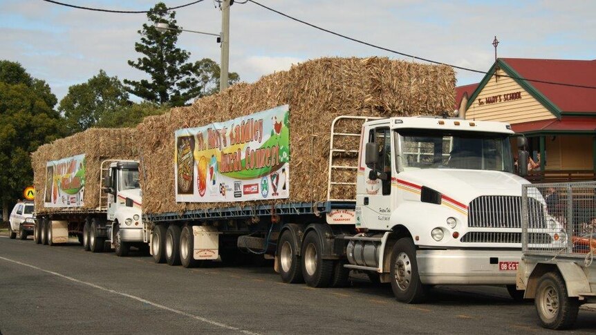 Trucks carrying feed for drought-stricken farmers in the South Burnett town of Proston head off on their journey.