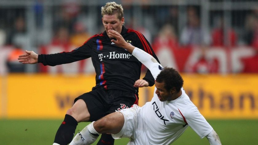 Even contest ... Bastien Schweinsteiger of Bayern Munich challenges Daniel Braaten of Bolton Wanderers