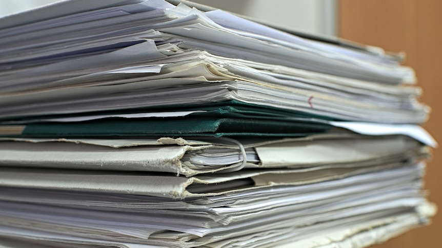 Stack of paper documents.