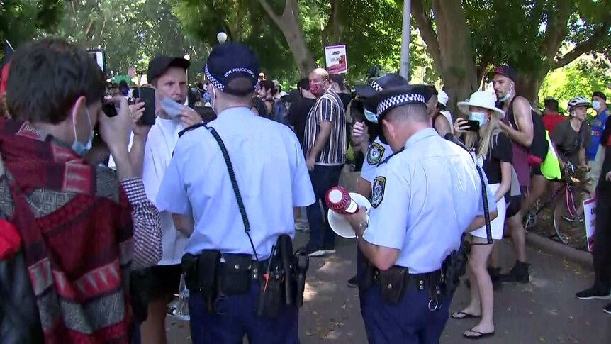 Two police in a verbal altercation with a protester