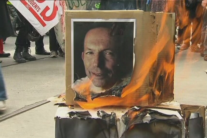 Students burn an effigy of Tony Abbott as they protest against university fees