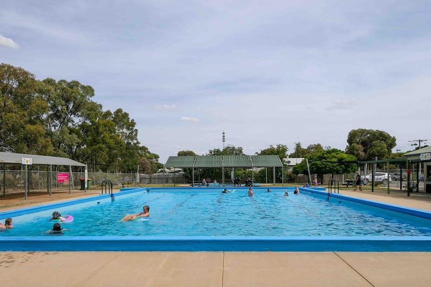 a big pool with people in it