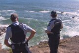 Police and surf life saving volunteers search for Saudi Arabian student missing in waters off Qld's Sunshine Coast