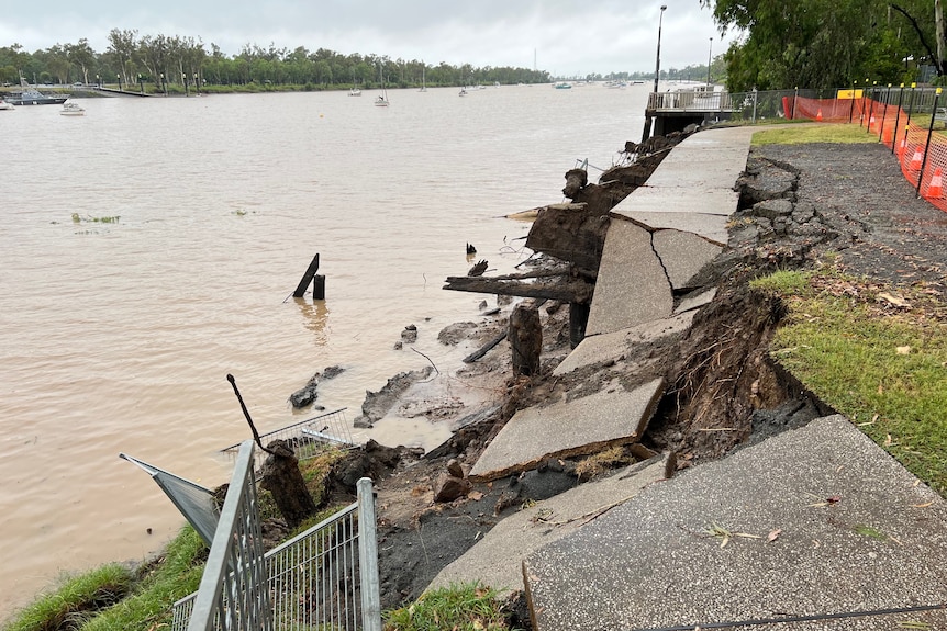 A footpath beside a river collapsed with the land underneath it washed away