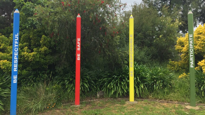 Coloured pencil sculptures in school ground