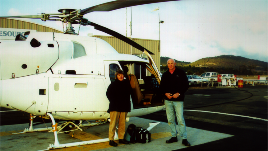 Willemina and John Watts standing next to the supplies helicopter for Maatsuyker Island, 1 May 2000.