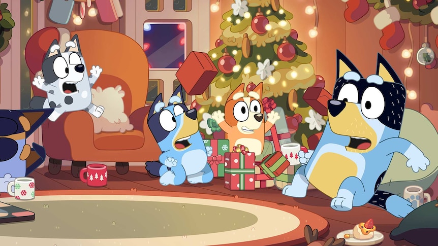 Bluey cast in a room with Christmas decorations