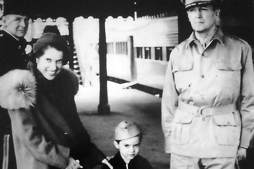 family at train station in the 1940s