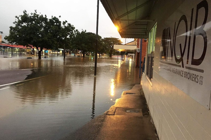 Flooding across a street in the Ingham town centre