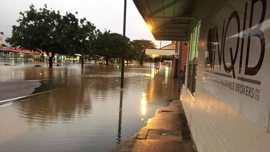 Flooding across a street in the Ingham town centre