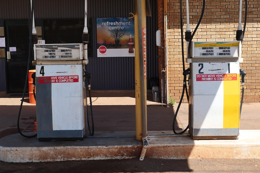 Two fuel bowsers out the front of a petrol station