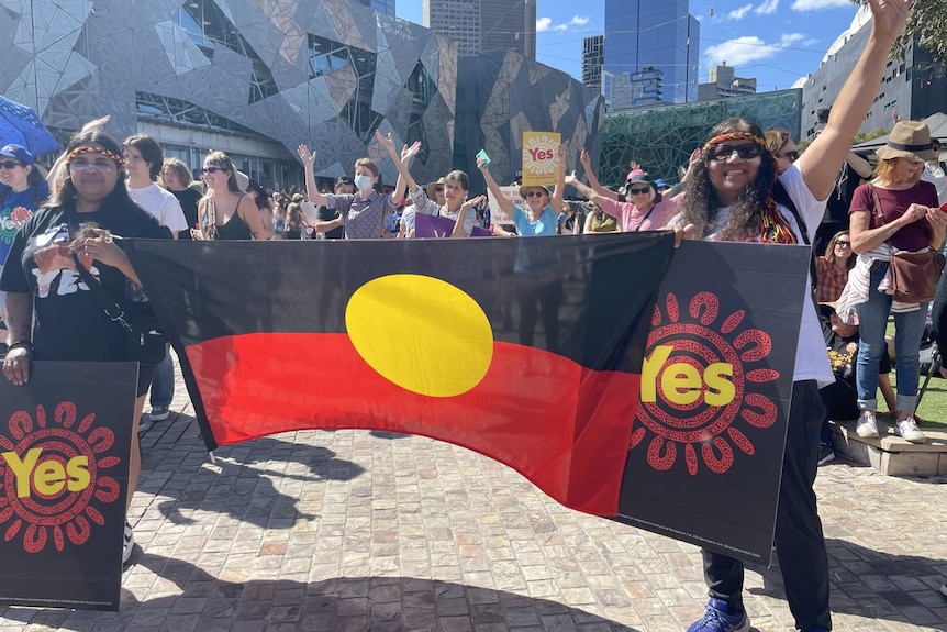 Melbourne Walk for Yes two people with flag