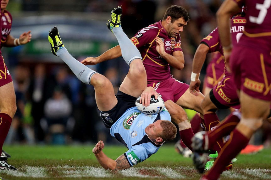 Lewis cops a tackle in Origin I