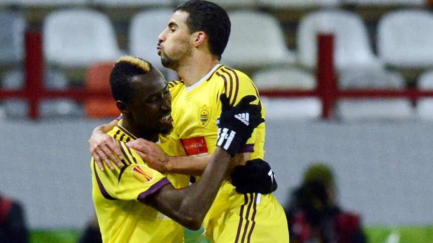 Moscow menace ... Anzhi Makhachkala's Lacina Traore (L) celebrates after scoring the winner.