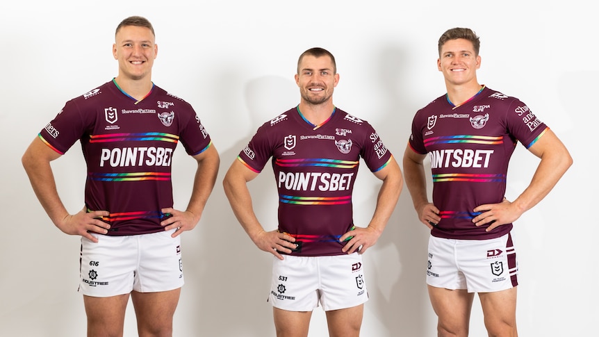 Three Manly players wearing the pride jersey