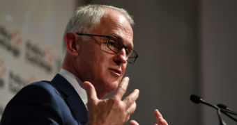 Malcolm Turnbull gestures with both hands while delivering a speech.