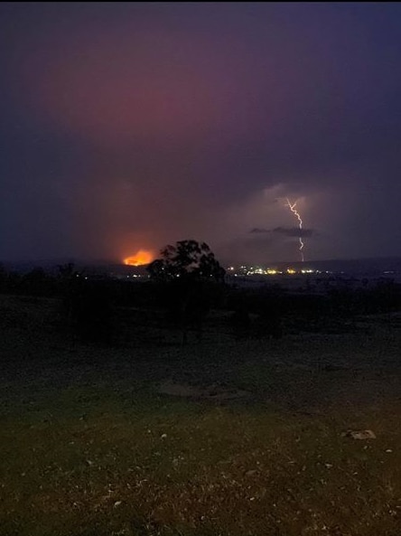Dry lightning strike east of Bruthen starts fire. Flames in hills.