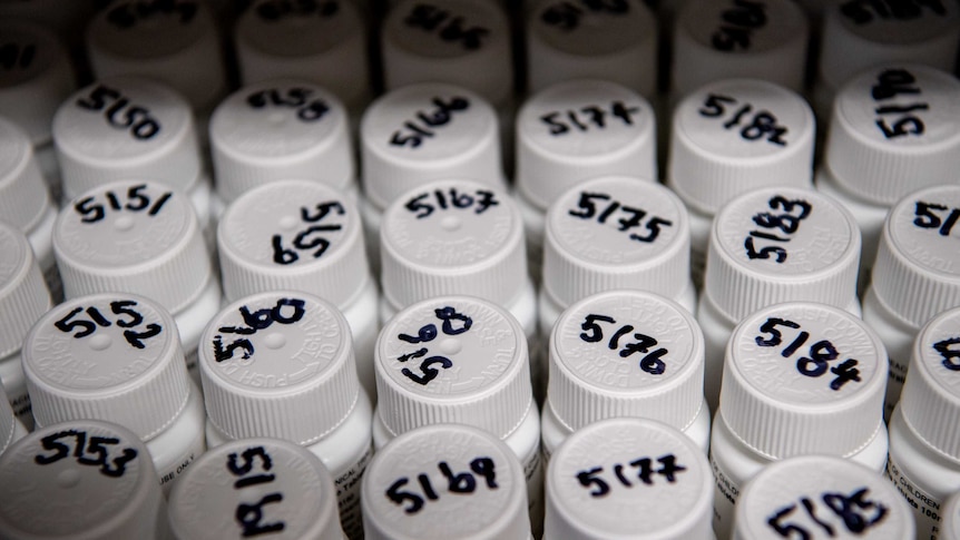 Bottles of pills with a number on the lid