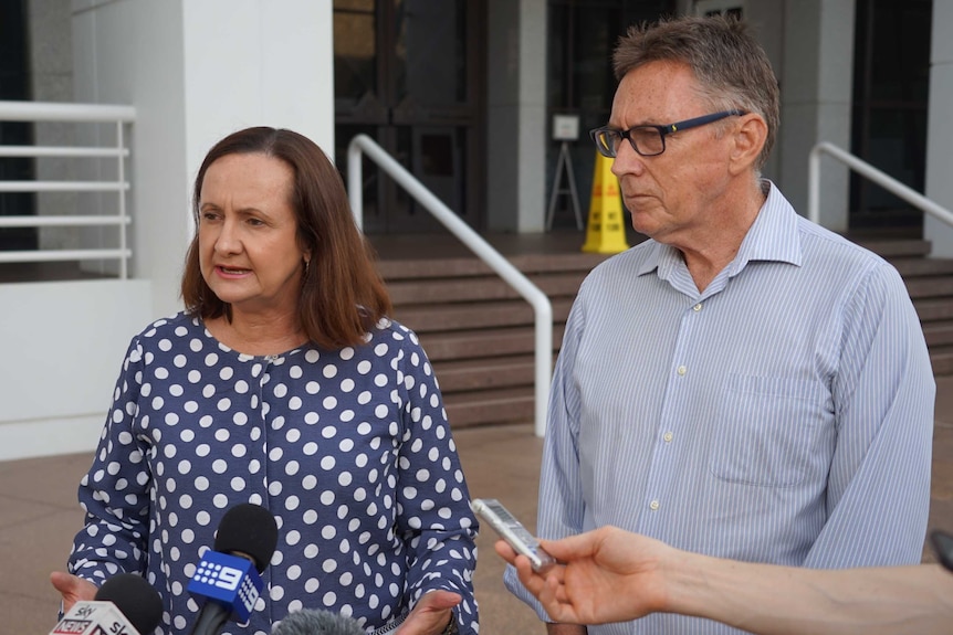 Two politicians standing in front of parliament house Darwin