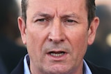Mark McGowan medium close up with a serious look on his face outside his Rockingham office.