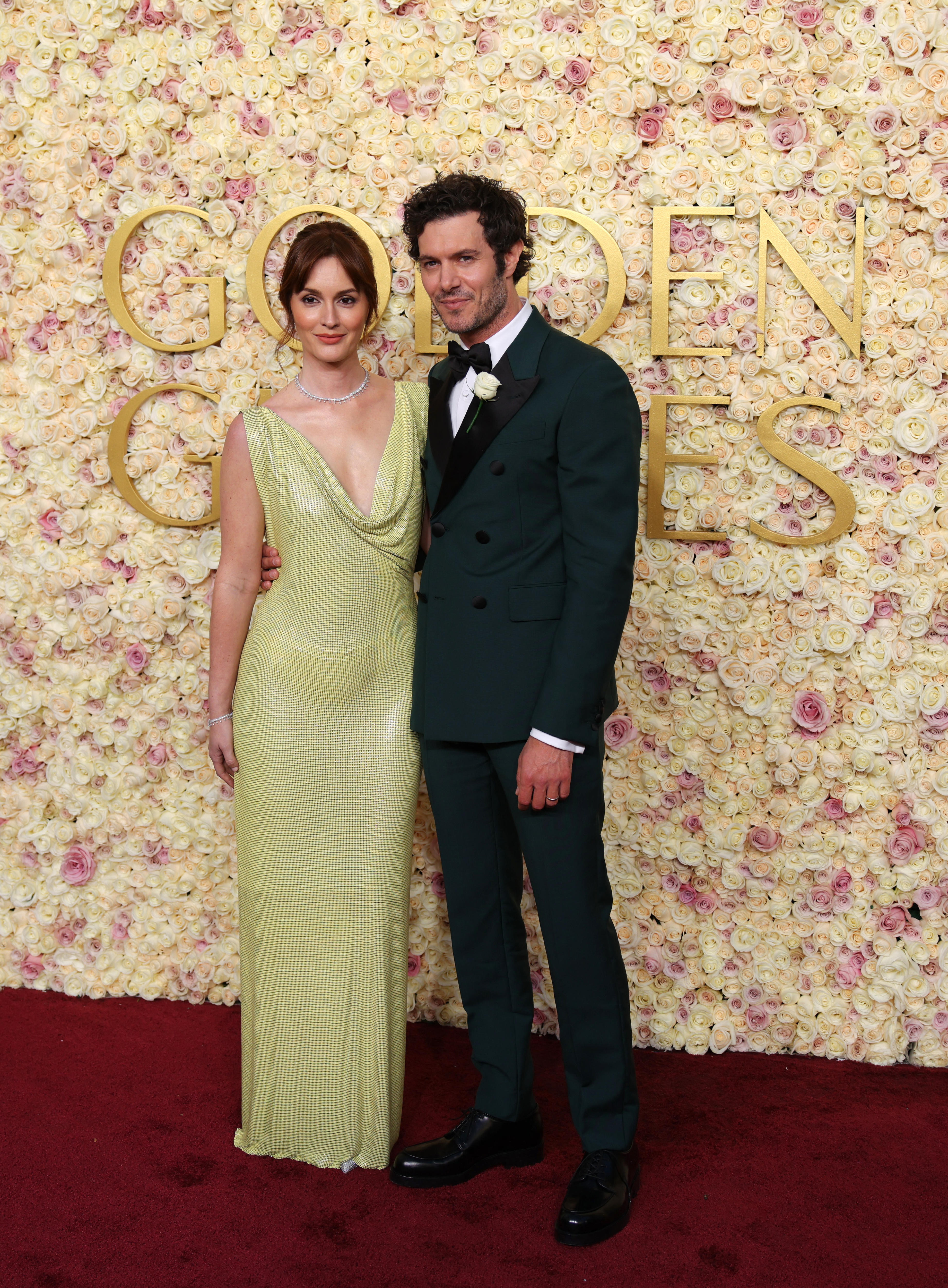 Leighton Meester and Adam Brody on the Golden Globes red carpet. Both are wearing different shades of green