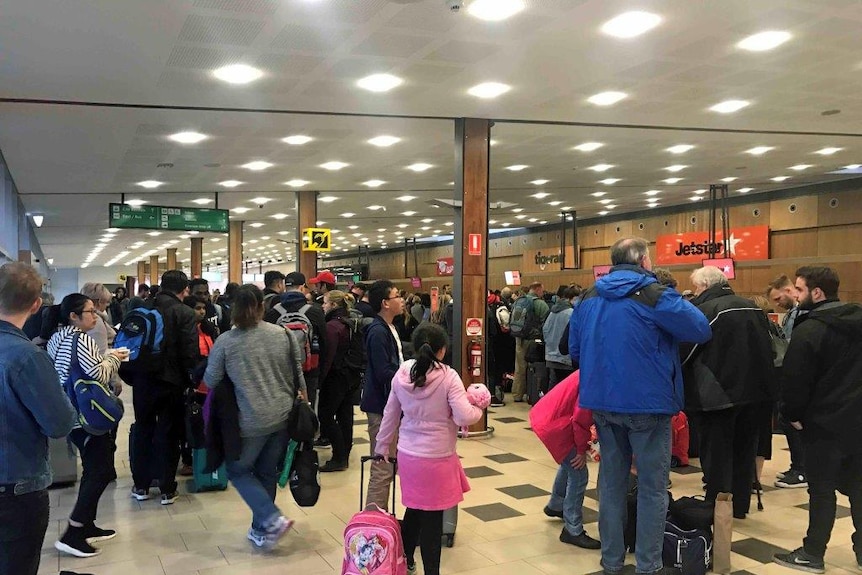 Passengers try to check in at Hobart airport