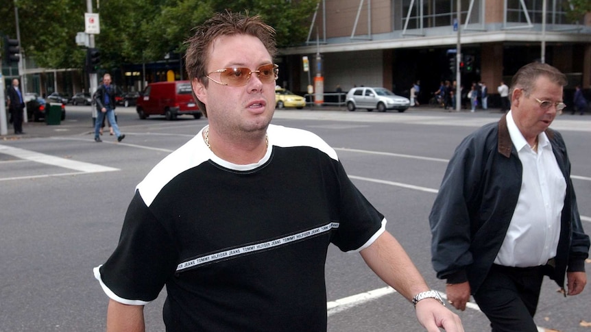 Carl Williams on the day of a court hearing, wearing sunglasses on a Melbourne street.