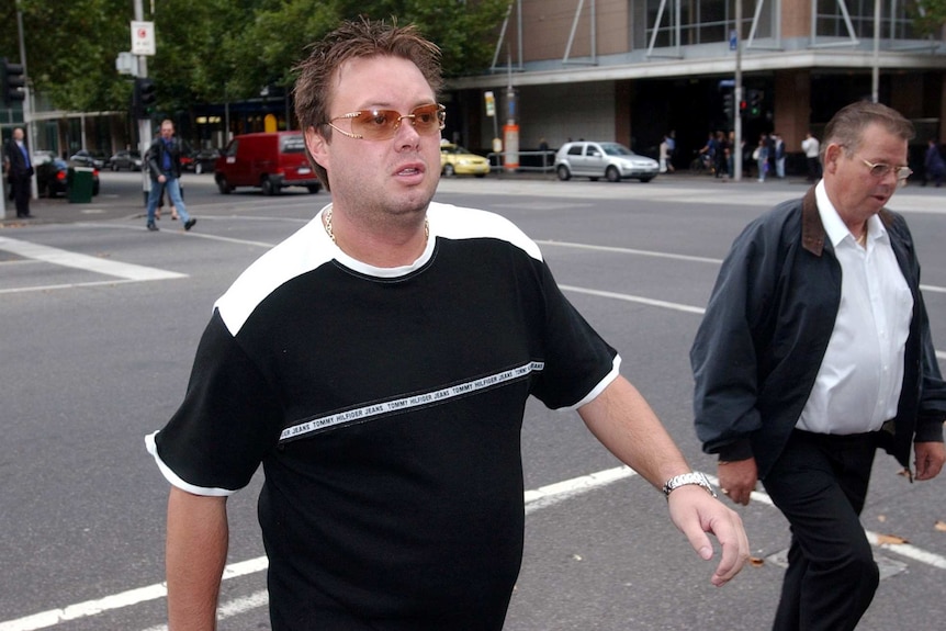 Carl Williams on the day of a court hearing, wearing sunglasses on a Melbourne street.