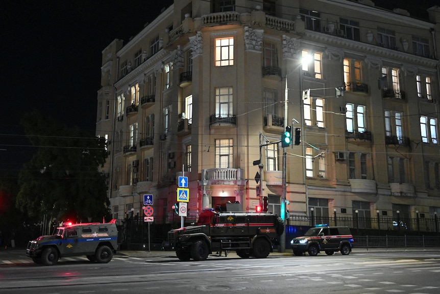 A tank driving through a street 