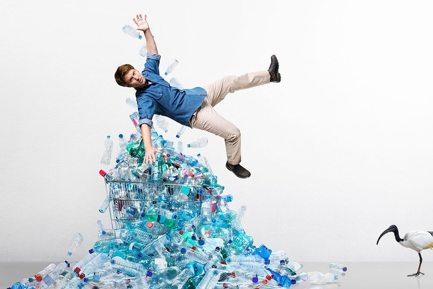 Craig Reucassel, suspended in the air over plastic bottles in a trolley and an ibis in the bottom right-hand corner