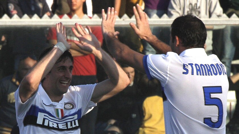 Inter on top: Milito (l) scored the opener just four minutes into the second half.