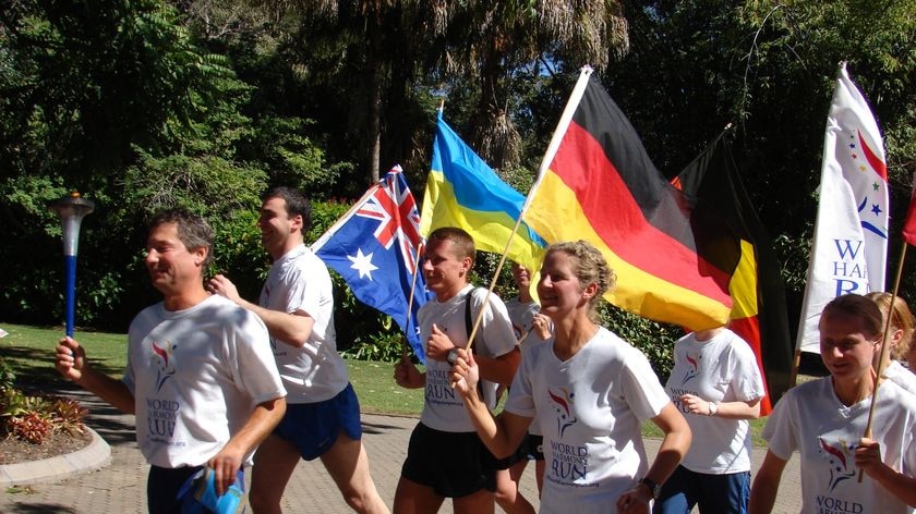 The runners scaled Mt Kosciuszko and crossed the Nullarbor as part of the World Harmony Run.