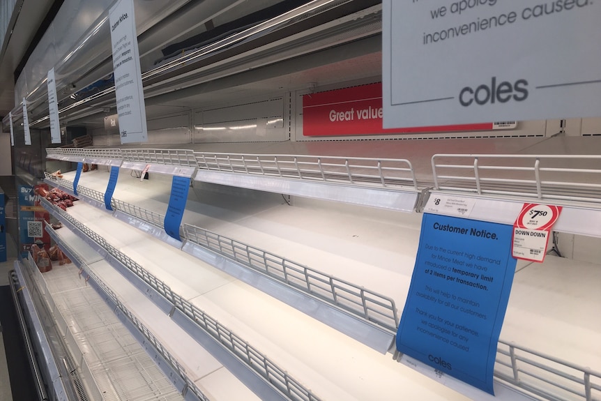 Empty shelves in the meat section of a Coles supermarket.
