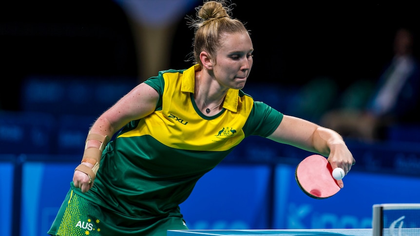 A female table tennis player uses a backhand during a game at the 2016 Paralympics.