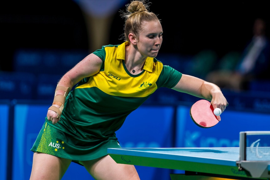 A female table tennis player uses a backhand during a game at the 2016 Paralympics.