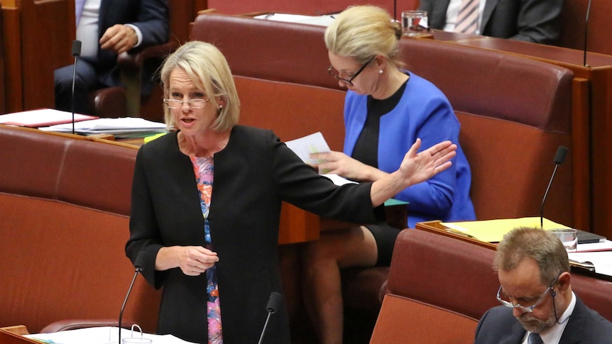 Senator Fiona Nash gestures to her left during Question Time.