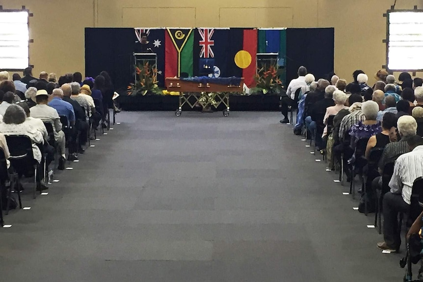 Friends, family and dignitaries gathered in Townsville with the coffin of Dr Evelyn Scott at the front of the room