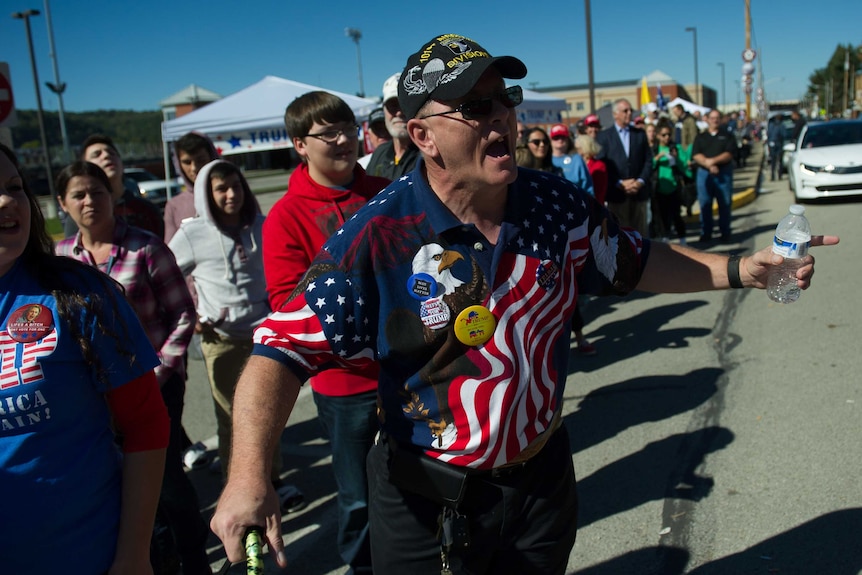 A Trump supporter having his say outside a rally.