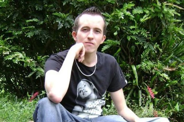 Convicted rapist Callum Joseph Haggerty posing on a retaining wall.