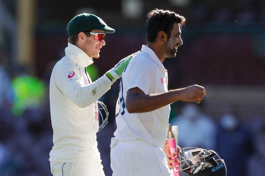 Australia wicketkeeper Tim Paine smiles as he puts his hand on the back of India batsman Ravi Ashwin after the SCG Test.