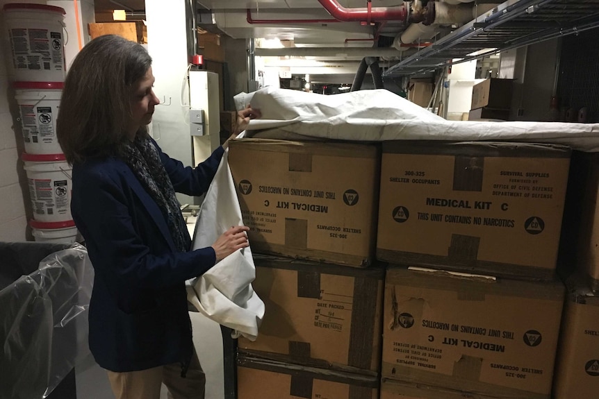 Senate photo historian Heather Moore uncovers forgotten US supplies in boxes marked medical kit.