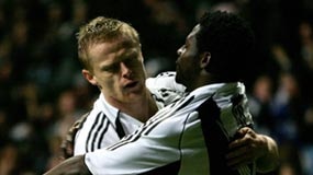 Obafemi Martins (r) congratulated by Damien Duff after goal for Newcastle United