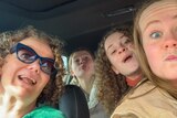 Mandy McCracken with her three teenage daughters in the car, on a interstate road trip as a solo parent.