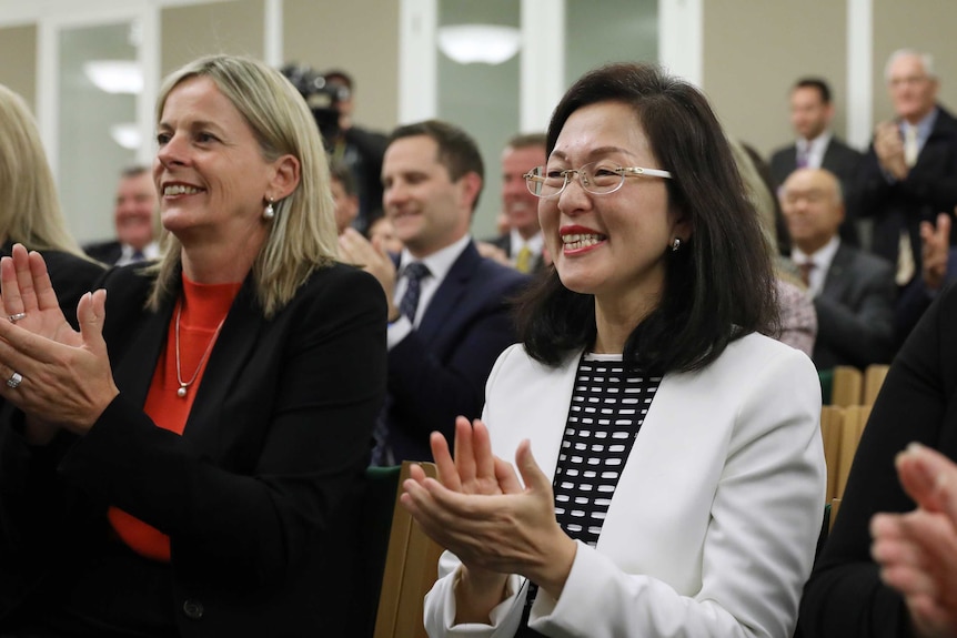 Gladys Liu, right, sitting in the joint partyroom this morning.