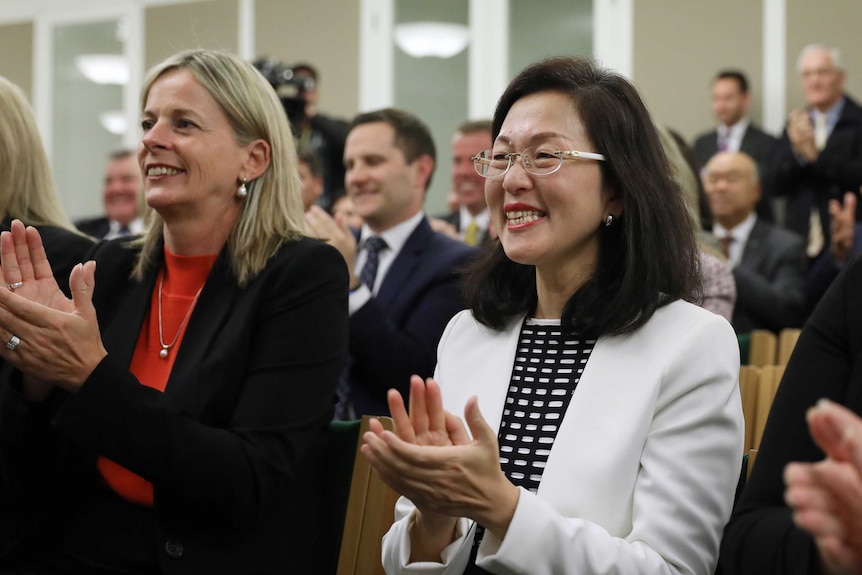 Gladys Liu claps as she takes part in the joint partyroom meeting.