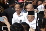 Indonesian President Joko "Jokowi" Widodo and his running mate Ma'ruf Amin greet their supporters