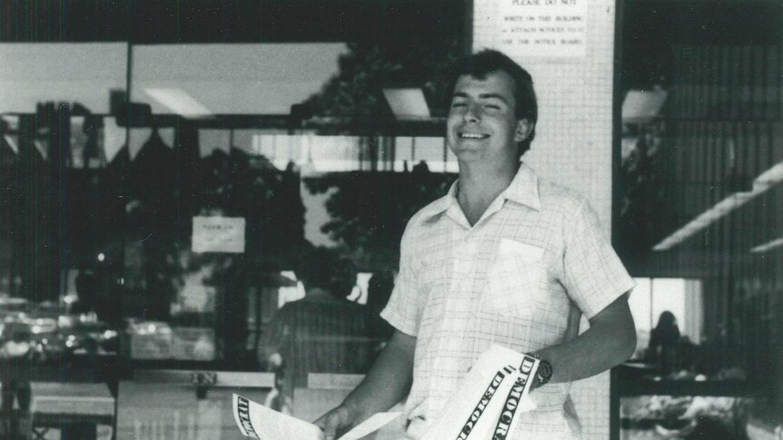 A black and white photo of a youthful Tony Abbott handing out flyers