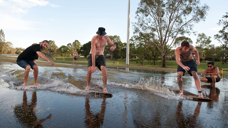 Locals skim board after hailstorm over Brisbane
