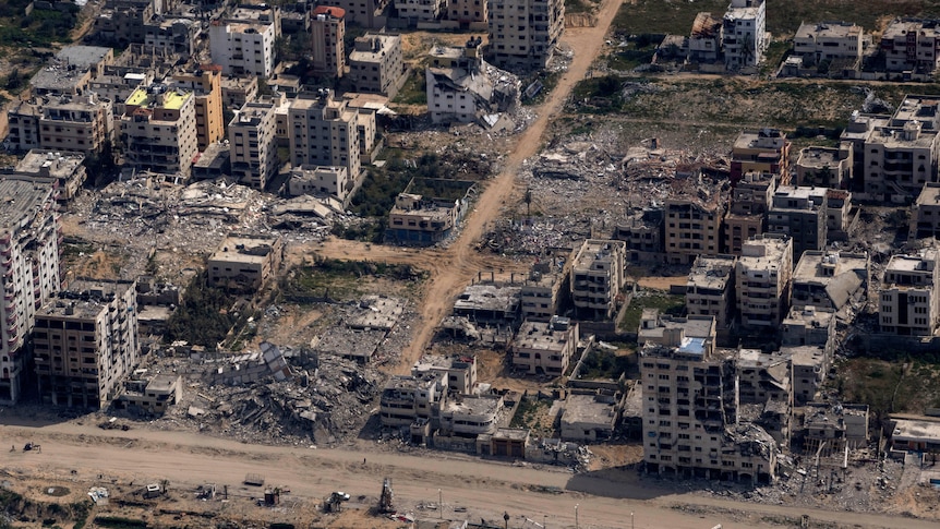 A view from above showing buildings destroyed to rubble. 